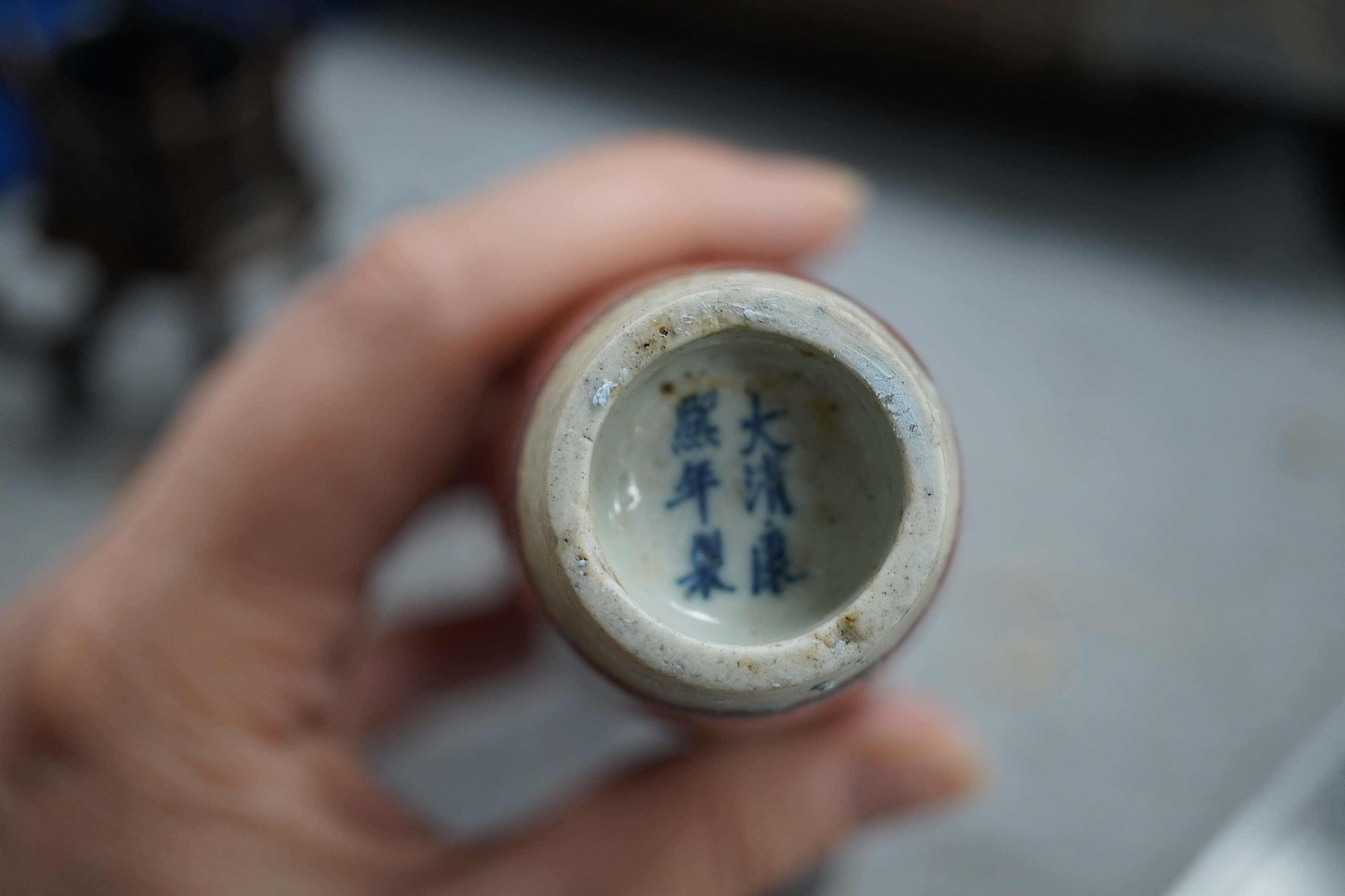 A small Chinese peach bloom glazed vase with fitted wood stand, Republic period